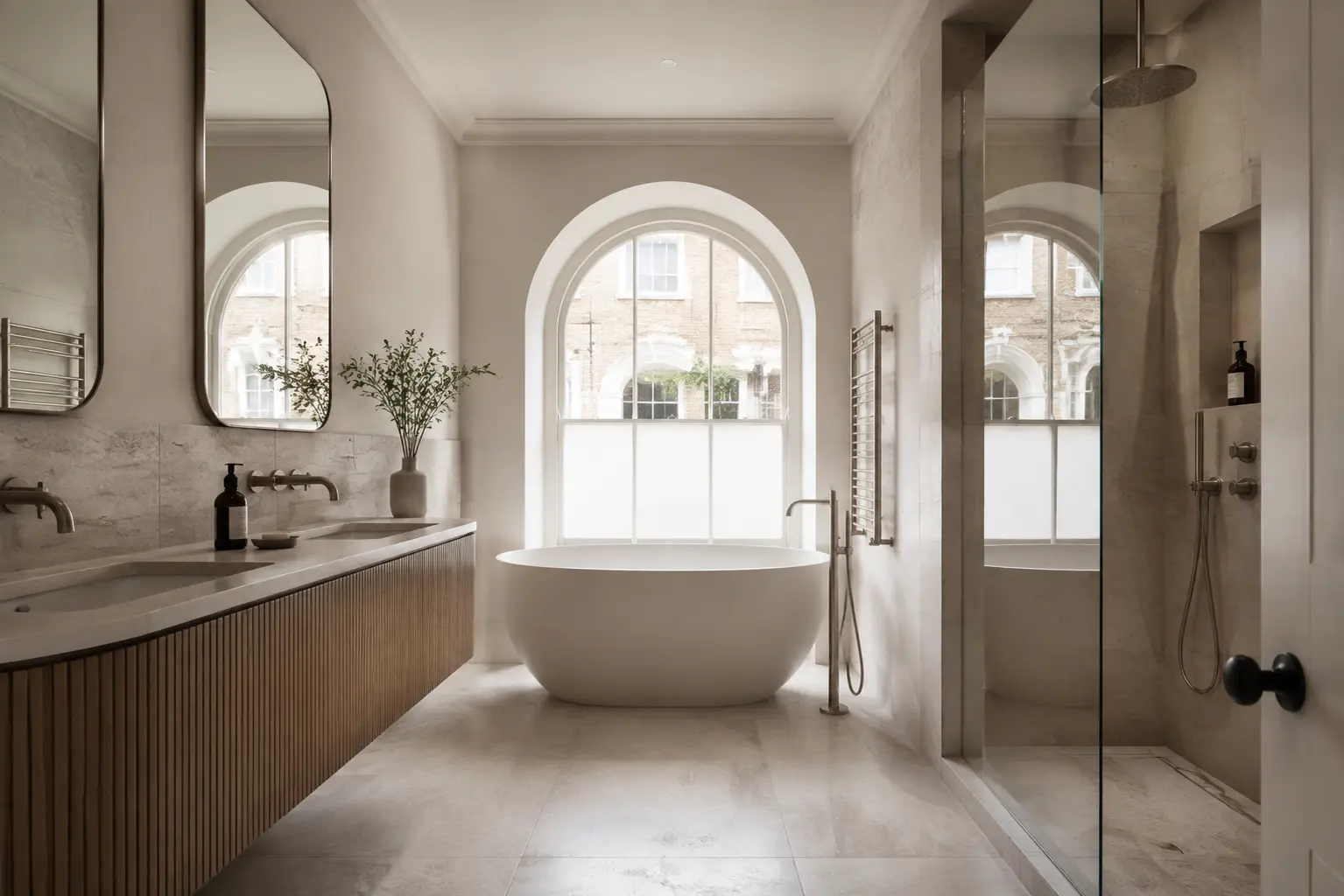 Photorealistic British bathroom visualisation balancing historic proportions with restrained contemporary materials and fittings. Luxury Georgian London bathroom 3D render with limestone, fluted oak vanity, arched window and sculptural bath