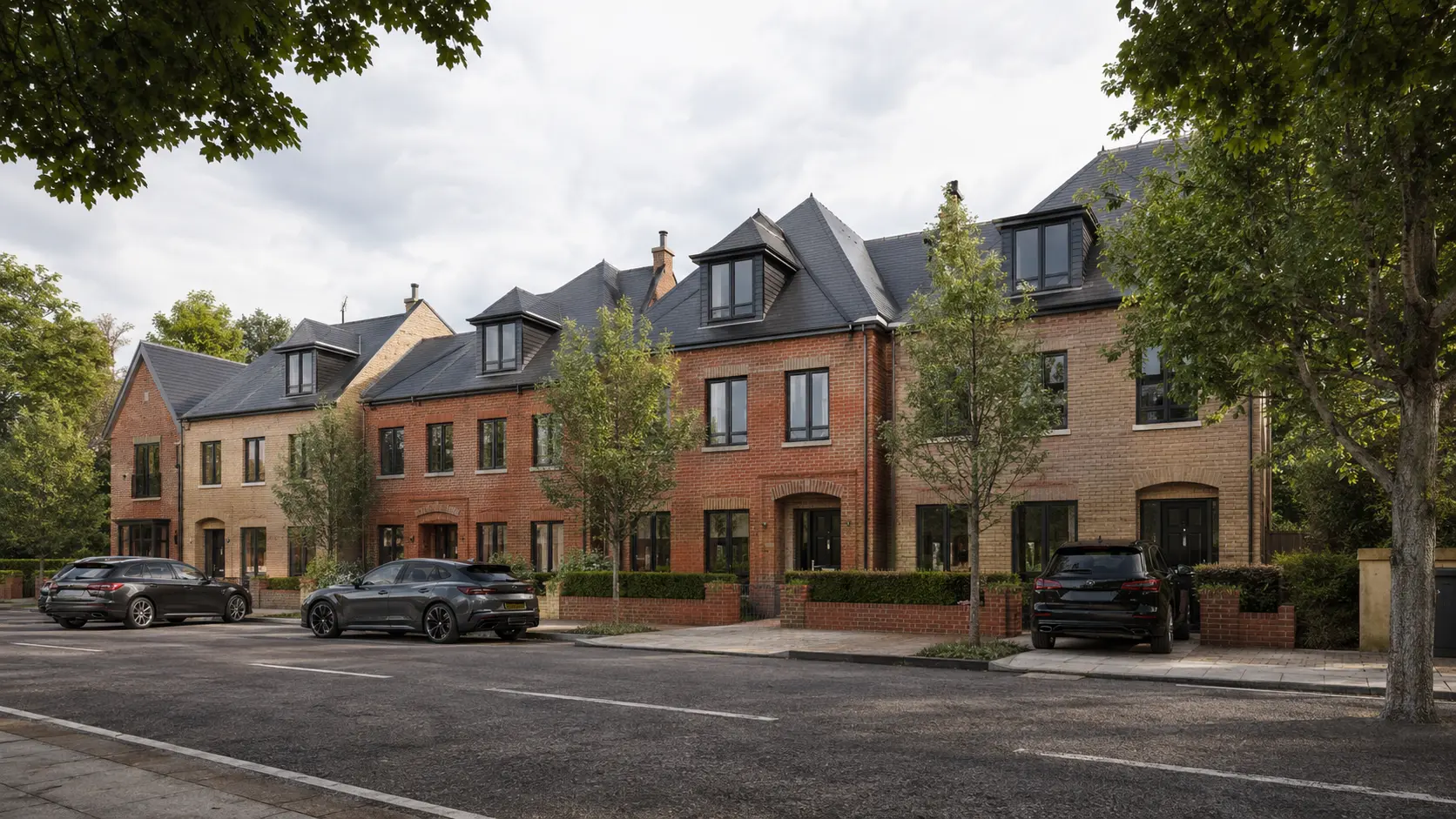 Residential development CGI presenting a coordinated row of contemporary British townhouses with authentic brickwork, slate roofs, dormers and a mature leafy streetscape. Photorealistic UK streetscape render of brick townhouses with slate roofs, dormers and landscaped front gardens in Surrey